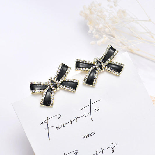 Astria Jewellery Black Cross Bow Statement Earrings for Women | Gold Plated Crystal Studded Designer Earrings | Bold Party Wear & Fashion Jewellery Astria Jewellery