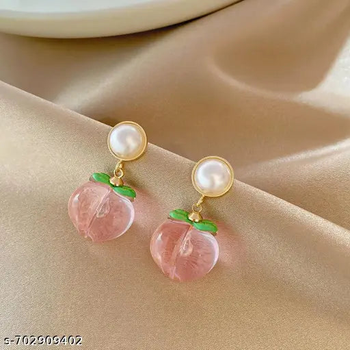 Luxury earrings for women featuring pearl drops, floral designs, and crystal studs in various styles