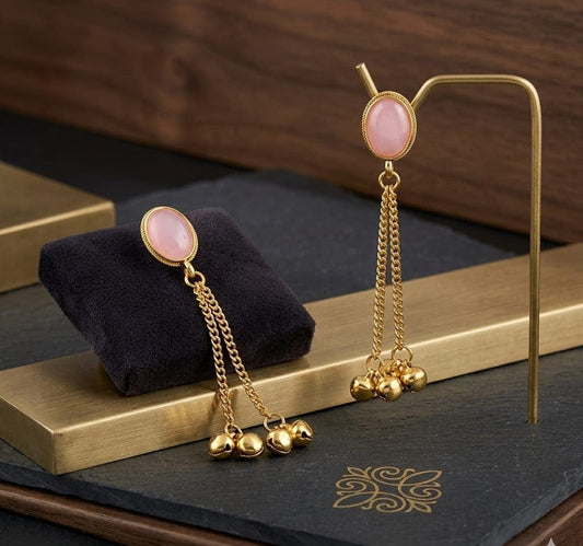 Gold-Plated Pink Stone Studded Long Dangle Earrings with Delicate Chain Drops and Small Ghungroo Bells ASTRIA JEWELLERY