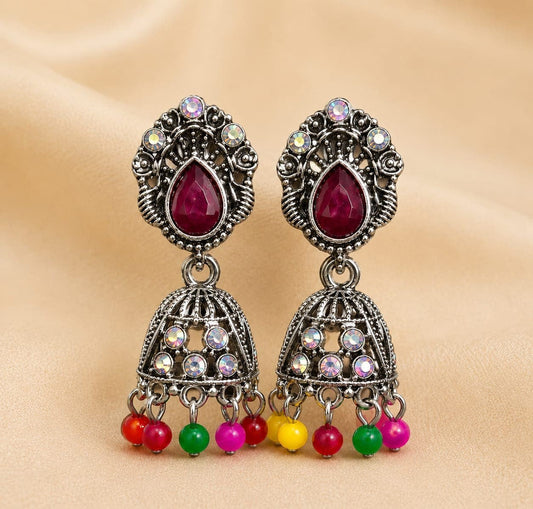 Oxidized Silver-Plated Magenta Stone Studded Traditional Jhumka Earrings ASTRIA JEWELLERY