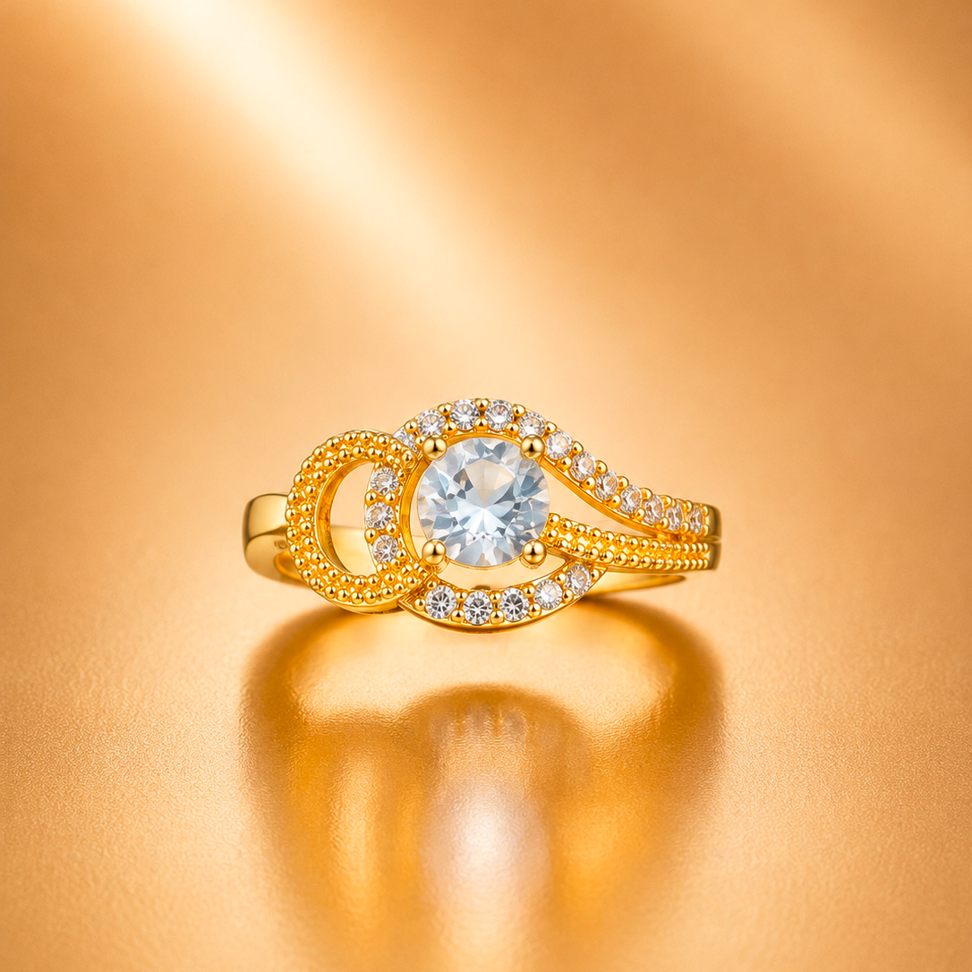 A gold ring with a large round clear center stone and surrounding small clear stones, set on a warm metallic gold background with a soft reflection.