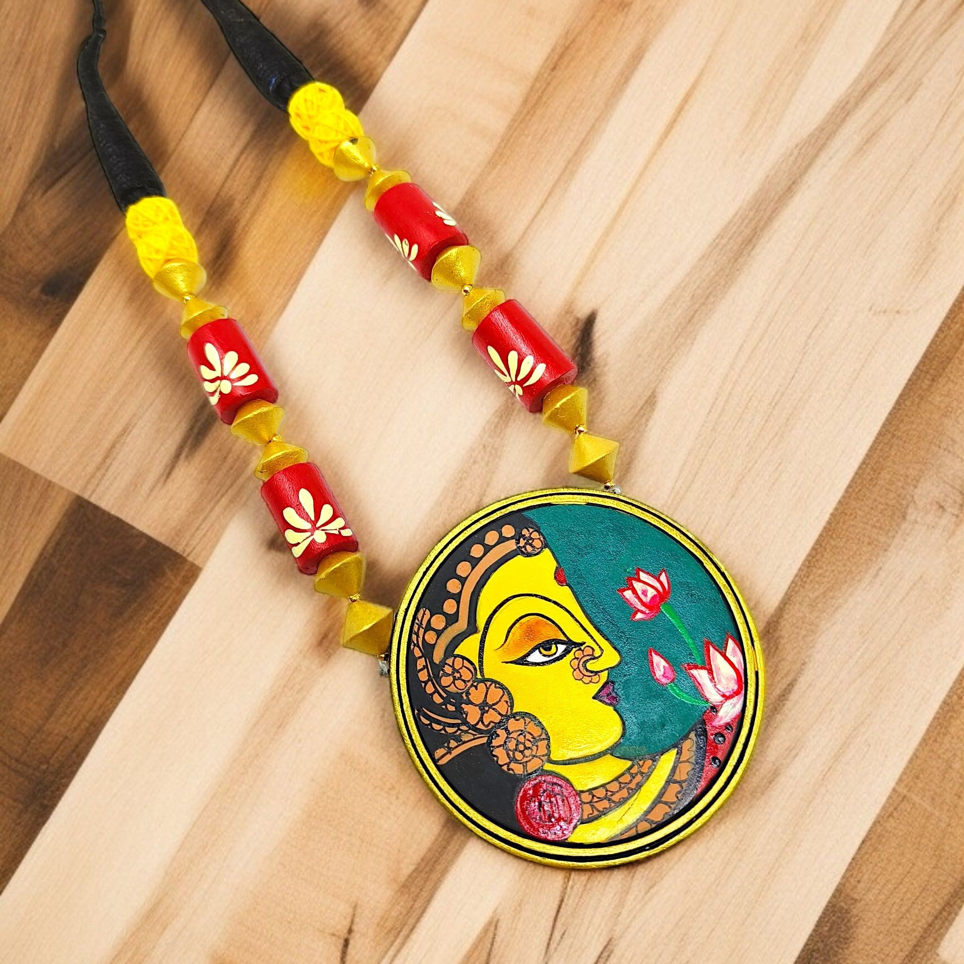 Handmade Indian necklace by ASTRIA JEWELLERY featuring colorful beads and a traditional painted pendant